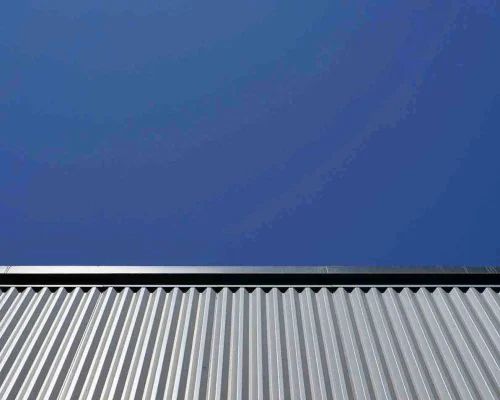 Impact-Roof-Maintenance-13 Picture of a steel roofline showing the ridge line and corrugated long run steel in Rotorua Bay of Plenty NZ.